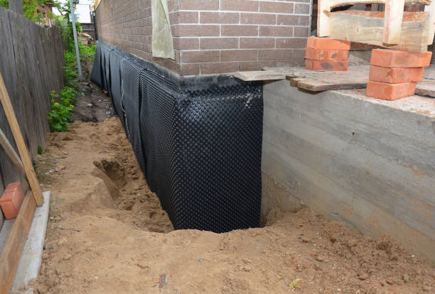 SJ Waterproofing Pros technician performing targeted Sump Pump Installation assessment in Loxley, AL